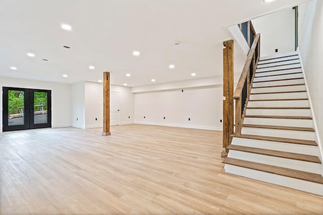 734 Main Rd, Charleston, ME 04422 - below grade area with french doors, stairs, recessed lighting, and light wood-type flooring