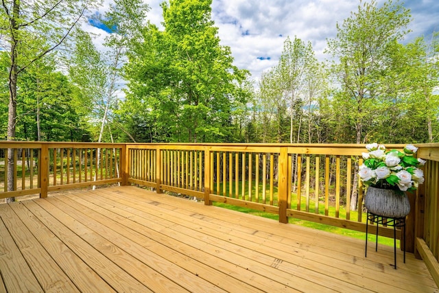 734 Main Rd, Charleston, ME 04422 - wooden terrace with view of wooded area