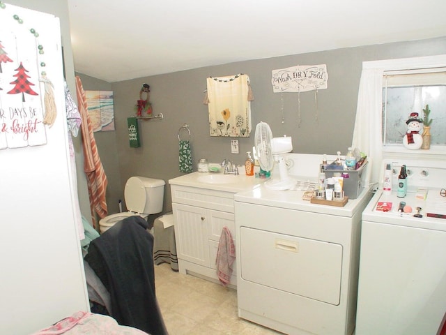 348-350 Lakeview Rd, Glenburn, ME 04401 - washroom featuring independent washer and dryer, light tile patterned floors, and cabinet space