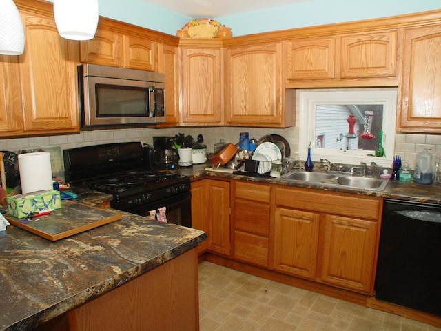 348-350 Lakeview Rd, Glenburn, ME 04401 - kitchen featuring black appliances, a sink, backsplash, and brown cabinetry