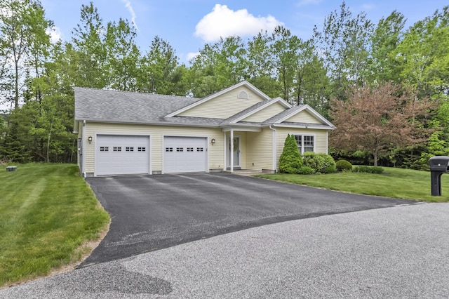 8 Macintosh Ln, Lewiston, ME 04240 - view of front facade featuring a garage, a shingled roof, driveway, and a front lawn