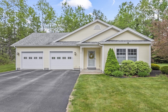 8 Macintosh Ln, Lewiston, ME 04240 - view of front of house with an attached garage, asphalt driveway, a shingled roof, and a front yard