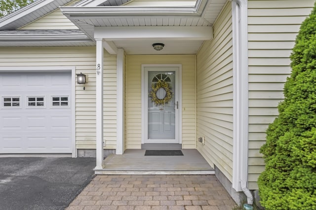 8 Macintosh Ln, Lewiston, ME 04240 - property entrance featuring an attached garage