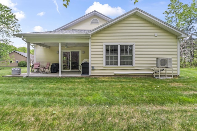 8 Macintosh Ln, Lewiston, ME 04240 - rear view of house featuring a ceiling fan, ac unit, a patio area, and a lawn
