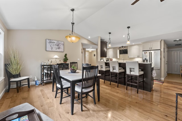 8 Macintosh Ln, Lewiston, ME 04240 - dining space with vaulted ceiling, light wood-style floors, ceiling fan, and baseboards