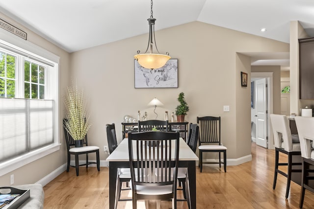 8 Macintosh Ln, Lewiston, ME 04240 - dining space featuring light wood finished floors, vaulted ceiling, and baseboards