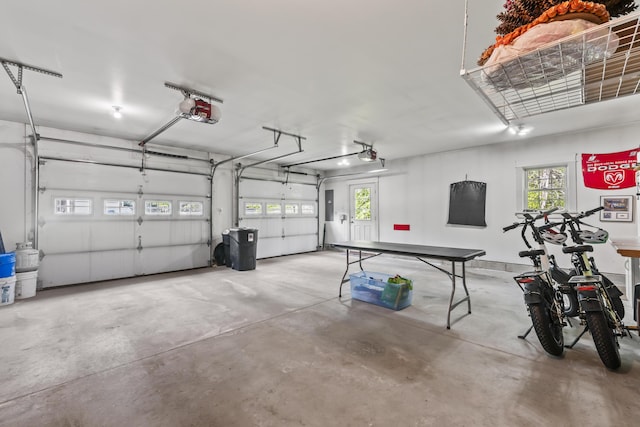 8 Macintosh Ln, Lewiston, ME 04240 - garage featuring a garage door opener and electric panel