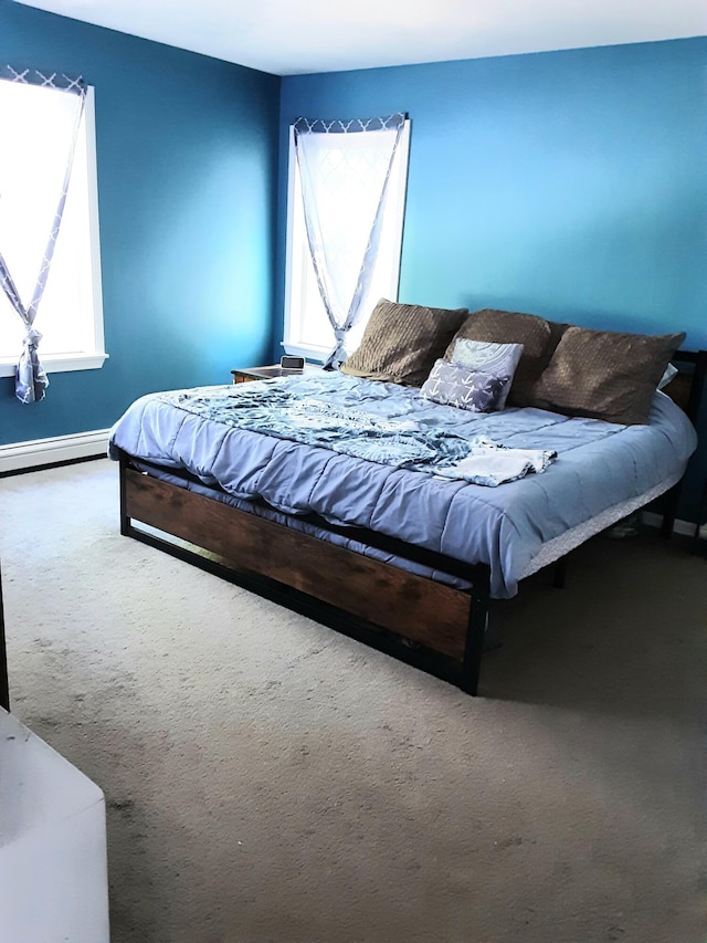51 Bunker Hill Rd, Jefferson, ME 04348 - carpeted bedroom featuring a baseboard radiator, multiple windows, and baseboards