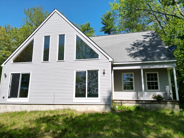 51 Bunker Hill Rd, Jefferson, ME 04348 - view of home's exterior with covered porch, a lawn, and roof with shingles