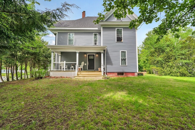 727 Hammond St, Bangor, ME 04401 - view of front facade featuring covered porch, a chimney, and a front yard