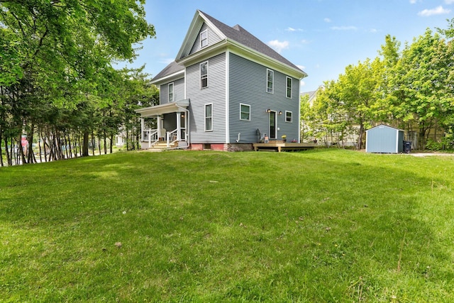 727 Hammond St, Bangor, ME 04401 - rear view of property featuring a yard