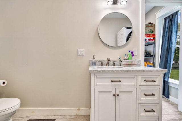 727 Hammond St, Bangor, ME 04401 - bathroom with baseboards, vanity, and toilet