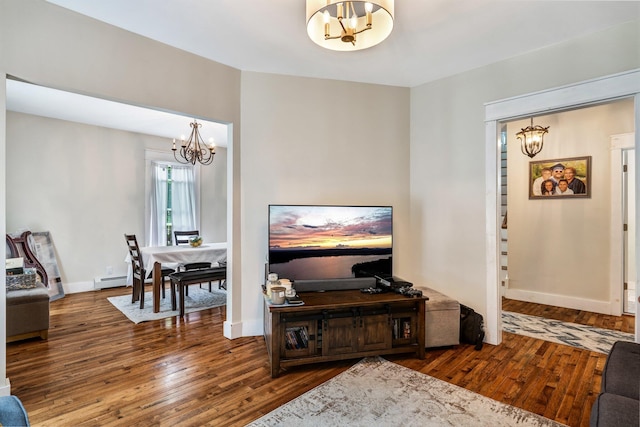 727 Hammond St, Bangor, ME 04401 - living room with a chandelier, wood finished floors, and a baseboard radiator