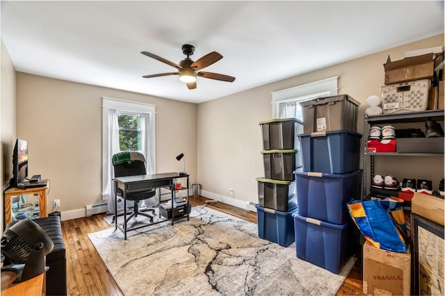 727 Hammond St, Bangor, ME 04401 - office space featuring ceiling fan, wood finished floors, baseboard heating, and baseboards