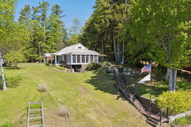 193 Park Ln, Windsor, ME 04363 - view of grassy yard with a sunroom