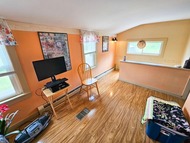 856 Weeks Mills Rd, New Sharon, ME 04955 - office space with a baseboard heating unit, vaulted ceiling, wood finished floors, and baseboards