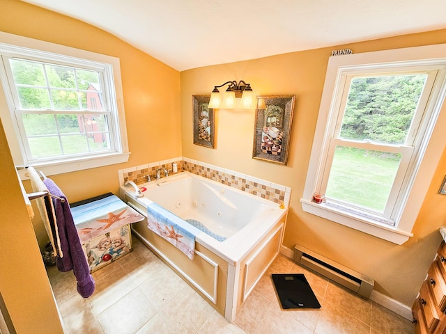 856 Weeks Mills Rd, New Sharon, ME 04955 - bathroom featuring a baseboard radiator, a whirlpool tub, vaulted ceiling, tile patterned flooring, and baseboards