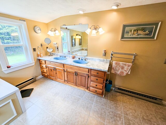856 Weeks Mills Rd, New Sharon, ME 04955 - bathroom with a baseboard heating unit, double vanity, and tile patterned flooring