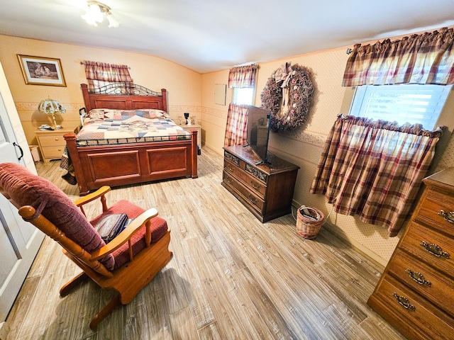 856 Weeks Mills Rd, New Sharon, ME 04955 - bedroom with light wood finished floors and vaulted ceiling