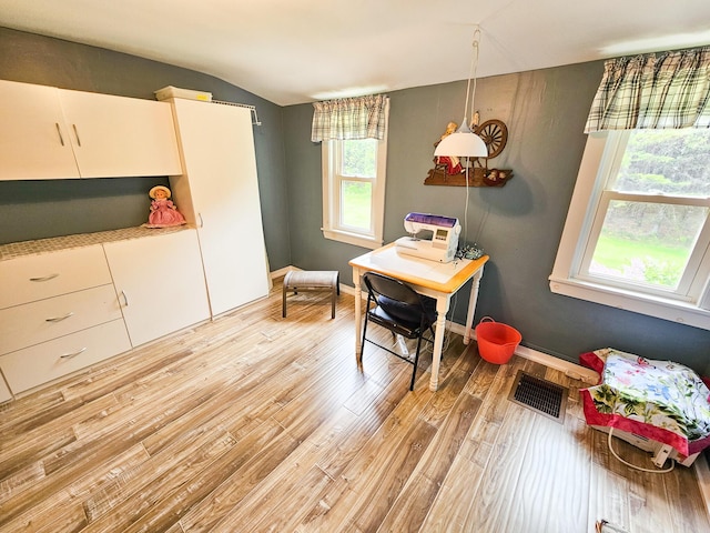 856 Weeks Mills Rd, New Sharon, ME 04955 - dining space with light wood-style floors, vaulted ceiling, and baseboards