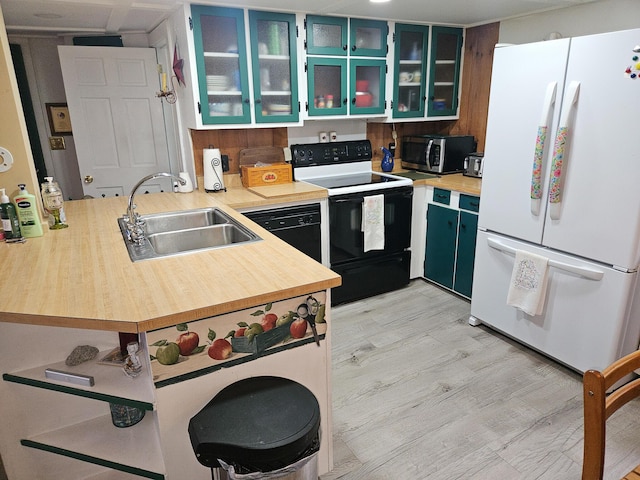 856 Weeks Mills Rd, New Sharon, ME 04955 - kitchen with freestanding refrigerator, electric range, a sink, stainless steel microwave, and a peninsula