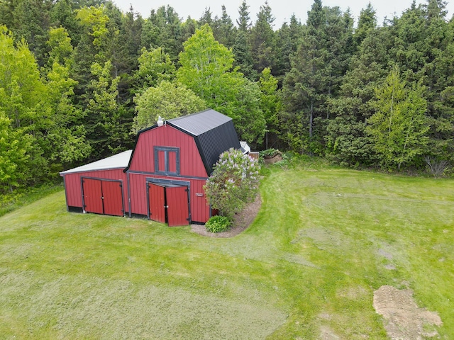 856 Weeks Mills Rd, New Sharon, ME 04955 - view of barn with a lawn and a view of trees
