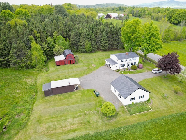 856 Weeks Mills Rd, New Sharon, ME 04955 - aerial view of property and surrounding area featuring a heavily wooded area