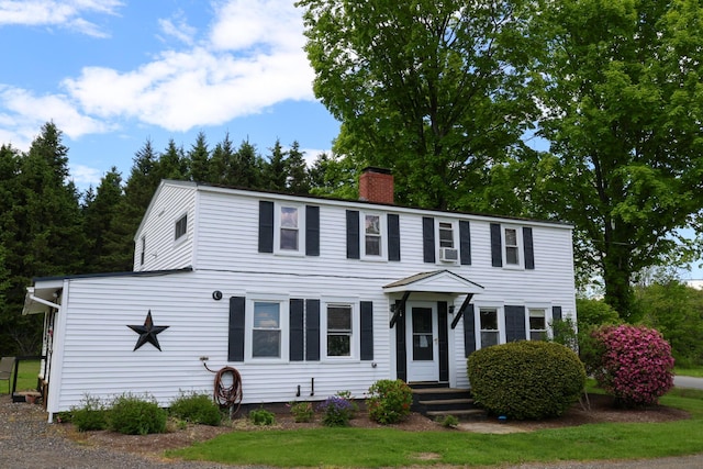 856 Weeks Mills Rd, New Sharon, ME 04955 - colonial home with a chimney, entry steps, and cooling unit
