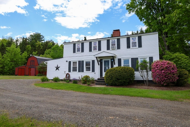 856 Weeks Mills Rd, New Sharon, ME 04955 - colonial house with a chimney, an outdoor structure, and a barn