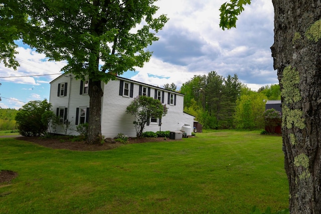 856 Weeks Mills Rd, New Sharon, ME 04955 - view of green lawn featuring central AC