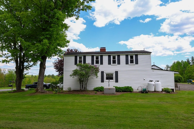 856 Weeks Mills Rd, New Sharon, ME 04955 - view of front facade featuring a front yard and a chimney