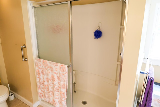 856 Weeks Mills Rd, New Sharon, ME 04955 - full bath featuring a stall shower, toilet, and tile patterned flooring