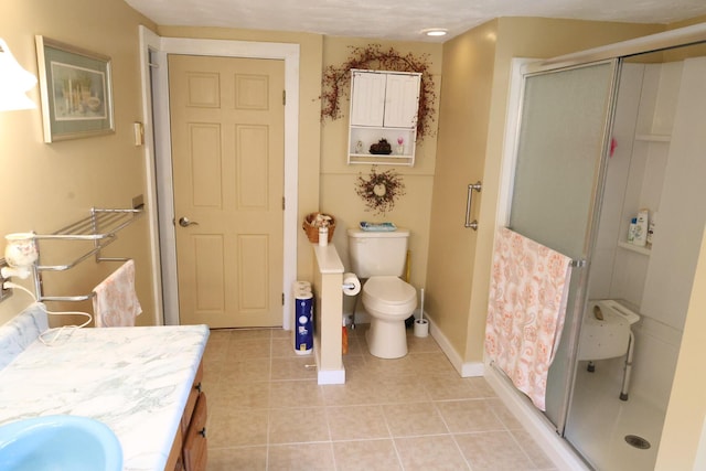 856 Weeks Mills Rd, New Sharon, ME 04955 - full bath with tile patterned floors, vanity, a stall shower, toilet, and baseboards