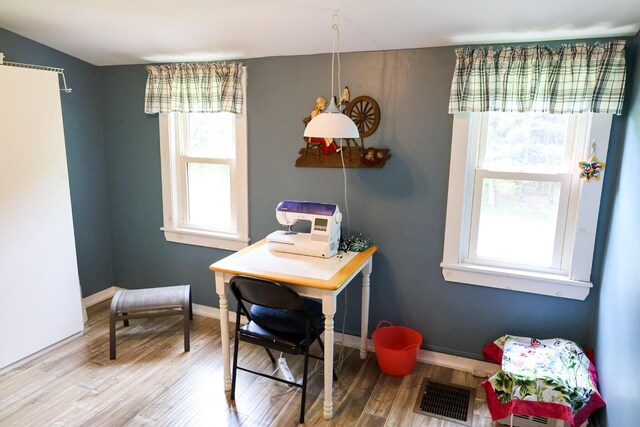 856 Weeks Mills Rd, New Sharon, ME 04955 - dining area featuring plenty of natural light, wood finished floors, and baseboards