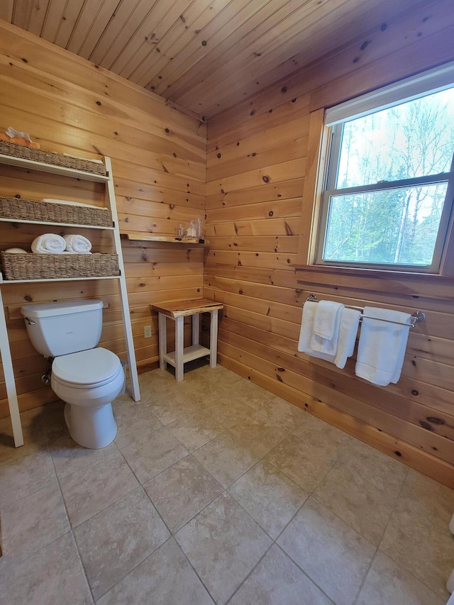 12 Jl Dr, Eustis, ME 04936 - bathroom featuring toilet, wood walls, wood ceiling, and tile patterned flooring