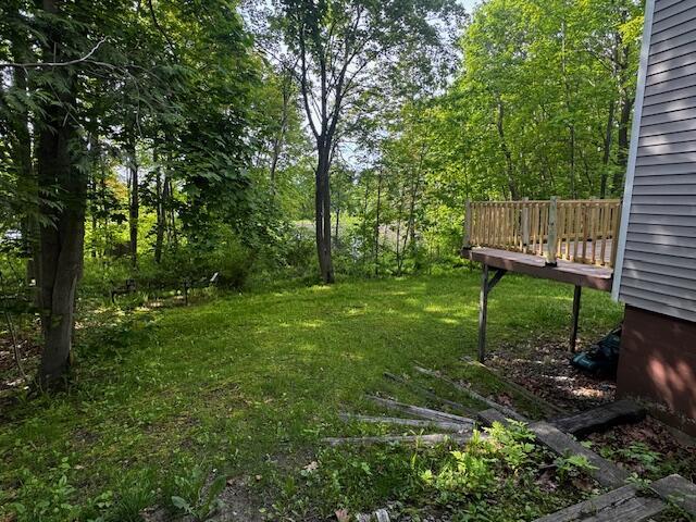 19 Prospect St, Skowhegan, ME 04976 - view of grassy yard featuring a deck