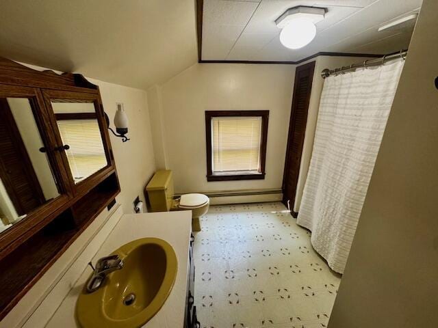 19 Prospect St, Skowhegan, ME 04976 - bathroom with vanity, toilet, tile patterned floors, baseboard heating, and lofted ceiling
