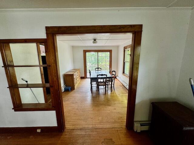 19 Prospect St, Skowhegan, ME 04976 - dining room with wood finished floors, a baseboard heating unit, and baseboards