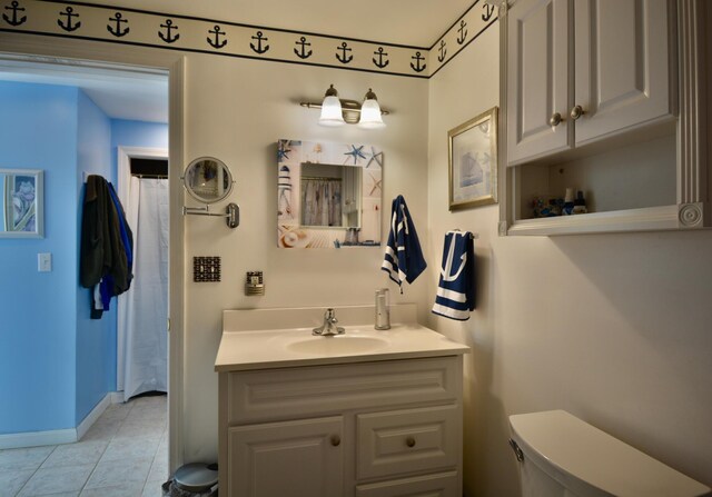 12B Trues Point Rd, New Gloucester, ME 04260 - full bath featuring vanity, toilet, tile patterned flooring, baseboards, and a shower with curtain