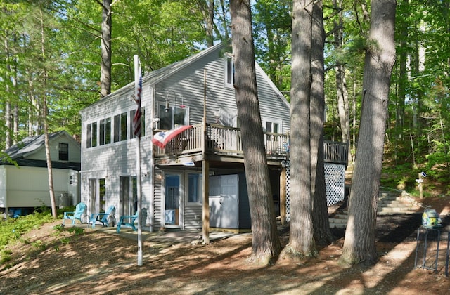12B Trues Point Rd, New Gloucester, ME 04260 - back of house with a wooden deck and view of scattered trees