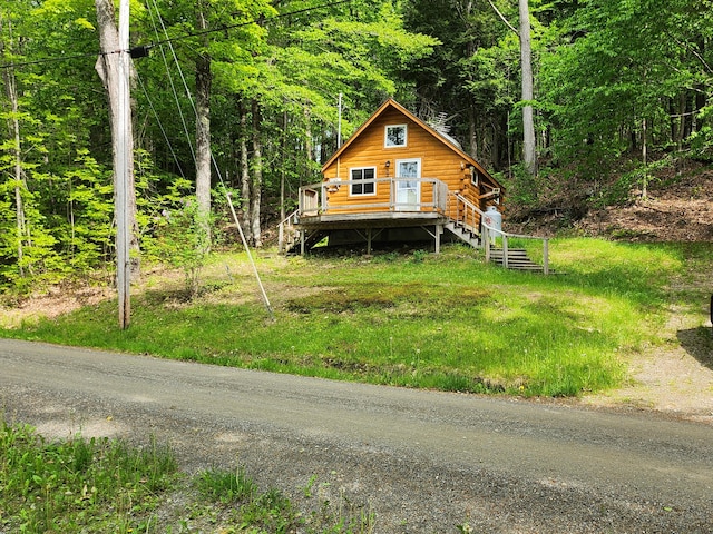 75 Snow Goose Ln, Dexter, ME 04930 - log-style house featuring log siding and a view of trees