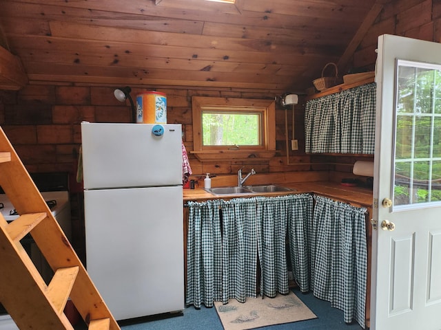 75 Snow Goose Ln, Dexter, ME 04930 - kitchen with freestanding refrigerator, a sink, vaulted ceiling, wooden ceiling, and plenty of natural light