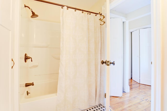 99 Silver St Unit 3-10, Portland, ME 04101 - full bath featuring shower / tub combo with curtain and wood finished floors