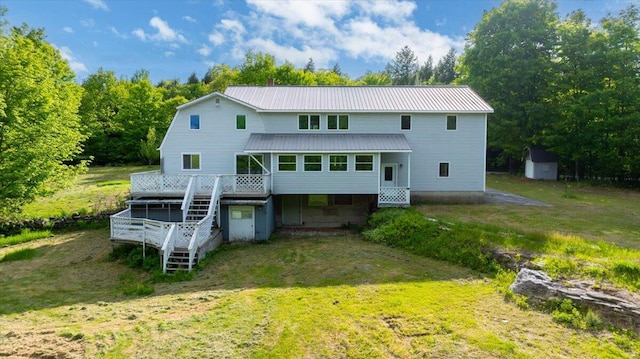 473 Davenport Hill Rd, Jay, ME 04239 - back of house featuring stairway, a deck, metal roof, and a yard