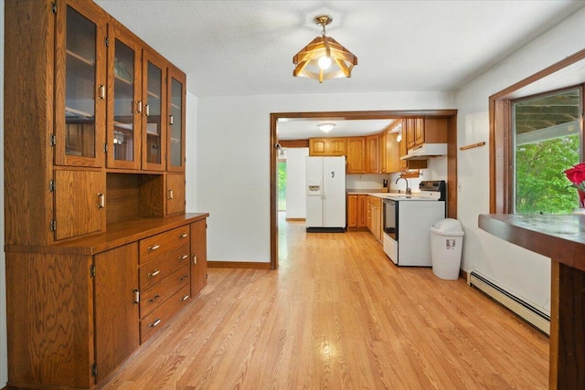 473 Davenport Hill Rd, Jay, ME 04239 - kitchen featuring white refrigerator with ice dispenser, range, a baseboard radiator, under cabinet range hood, and light wood-type flooring