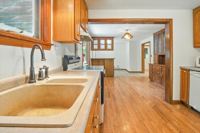 473 Davenport Hill Rd, Jay, ME 04239 - kitchen featuring white appliances, brown cabinets, a sink, and under cabinet range hood