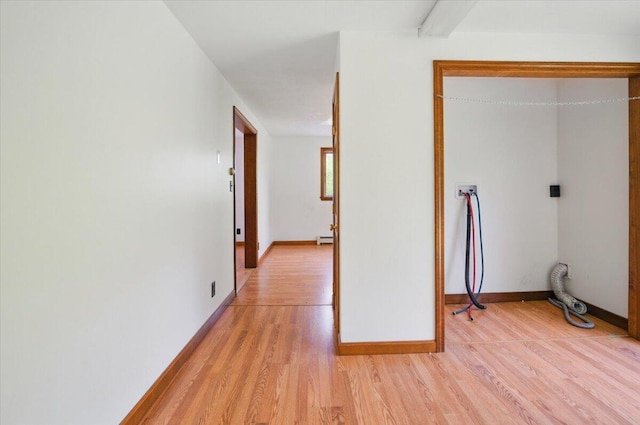 473 Davenport Hill Rd, Jay, ME 04239 - hallway featuring light wood-style floors, baseboards, and a baseboard radiator