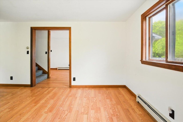 473 Davenport Hill Rd, Jay, ME 04239 - spare room with baseboard heating, light wood-type flooring, and healthy amount of natural light