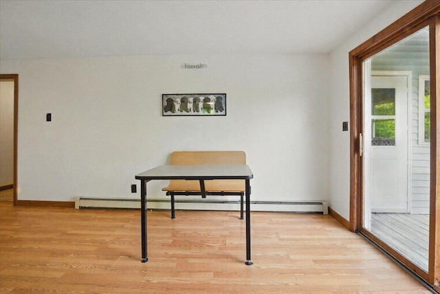 473 Davenport Hill Rd, Jay, ME 04239 - dining area with light wood-style floors, baseboard heating, and baseboards