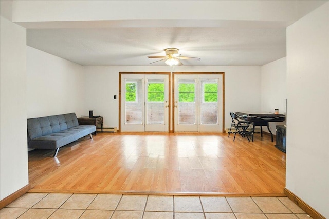 473 Davenport Hill Rd, Jay, ME 04239 - sitting room featuring light wood-style floors, ceiling fan, a baseboard radiator, and baseboards